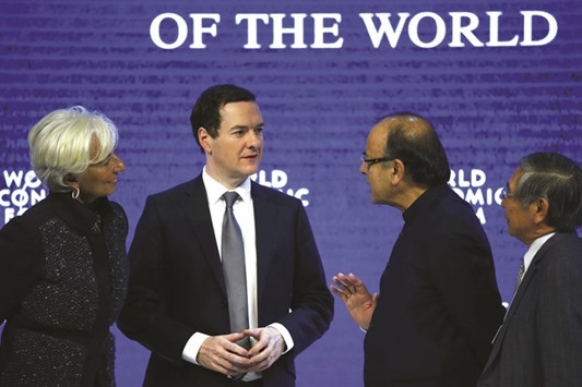 From left: Christine Lagarde, managing director of the International Monetary Fund (IMF); George Osborne, Britainu2019s Chancellor of the Exchequer; Arun Jaitley, Minister of Finance of India and Haruhiko Kuroda, governor of the Bank of Japan talk after the session u2018The Global Economic Outlooku2019 during the annual meeting of the World Economic Forum (WEF) in Davos, Switzerland yesterday.