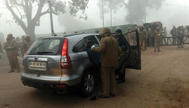 Security personnel check a vehicle at a check point prior to the full dress rehearsal for the upcoming Republic Day parade on Rajpath in New Delhi yesterday.