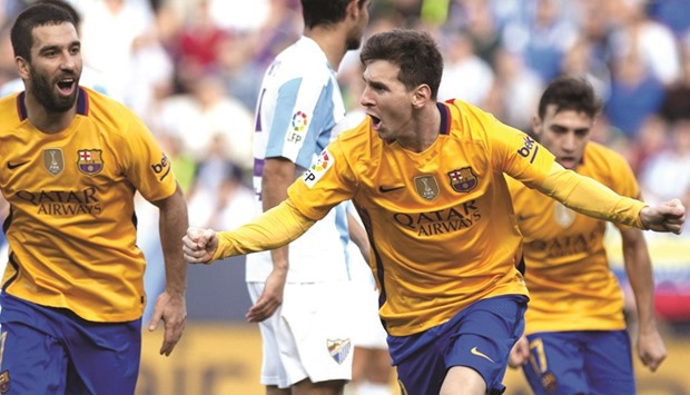 Barcelona star Lionel Messi celebrates after scoring against Malaga during the Spanish La Liga match at La Rosaleda stadium in Malaga yesterday. (AFP)