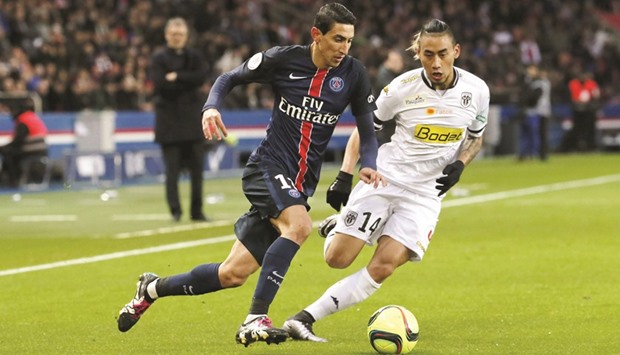 Paris St Germainu2019s Angel Di Maria (left) attempts to get past Angersu2019 Billy Ketkeophomphone during the French Ligue 1 match. (Reuters)