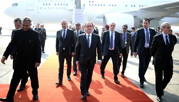 French President Francois Hollande (C) arrives at the Indian military base in Chandigarh. AFP