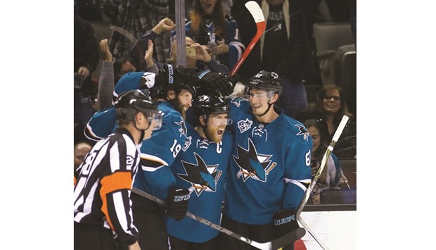 Surrounded by teammates, the San Jose Sharksu2019 Joe Pavelski celebrates his game-winning goal against the Minnesota Wild in the third period at SAP Arena in San Jose, California. (Jim Gensheimer/Bay Area News Group/TNS)
