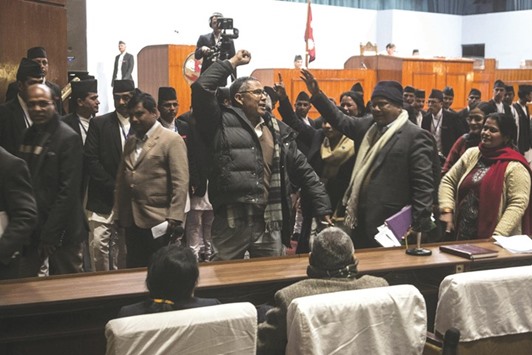Nepalese lawmakers protest during voting for the constitution amendment bill in Kathmandu on Saturday.