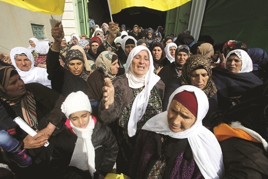 Palestinian women reacting during the funeral of Palestinian girl Ruqayya Abu Eid, 13, in the West Bank town of Yatta, south of Hebron, yesterday.