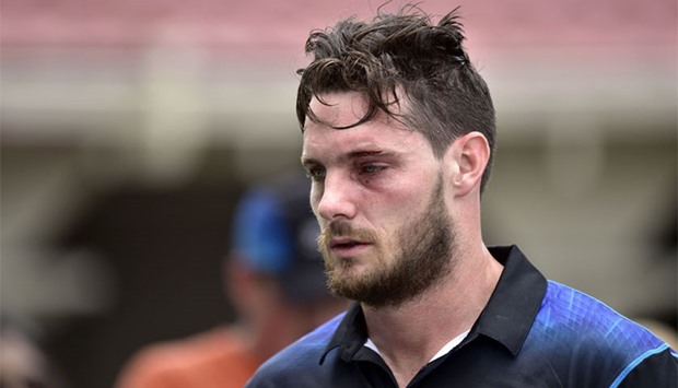 Mitchell McClenaghan of New Zealand walks from the field after being hit by the ball above the eye during the first one-day international between New Zealand and Pakistan at the Basin Reserve in Wellington.   AFP
