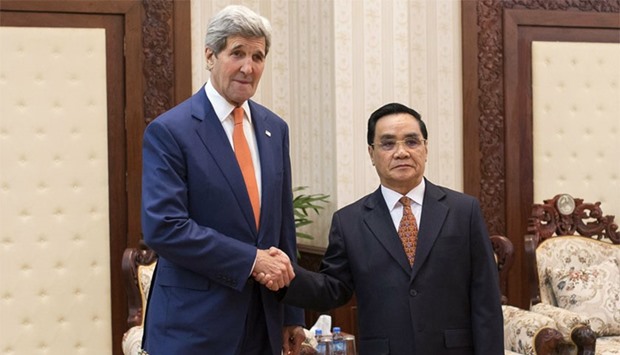 U.S. Secretary of State John Kerry shakes hands with Laos' Prime Minister Thongsing Thammavong during their meeting at the Prime Minister's Office in Vientiane, Laos. AFP