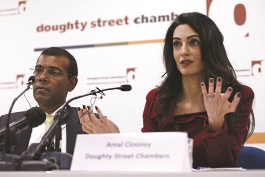 Lawyer Amal Clooney sits with Mohamed Nasheed during a news conference in central London yesterday.
