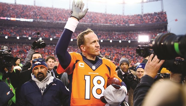 Denver Broncos quarterback Peyton Manning waves to the crowd after winning the AFC Championship game against the New England Patriots at Sports Authority Field at Mile High. PICTURE: USA TODAY Sports