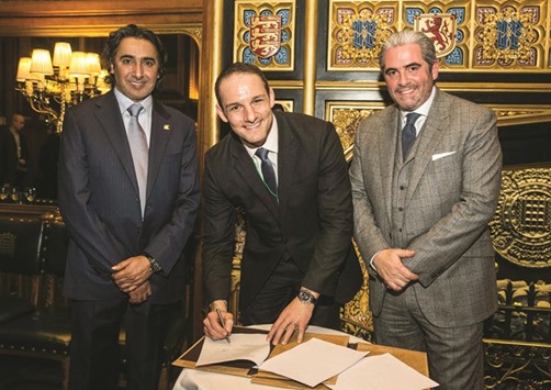 Mohamed Hanzab with David Grevemberg and Emanuel Medeiros during the agreement signing ceremony.