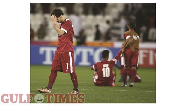 Qatar players are dejected after their 1-3 loss to South Korea in the AFC U23 Championship semi-final match yesterday. PICTURES: Noushad Thekkayil