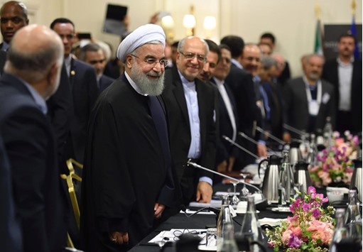 Rouhani attends a meeting with French ministers and representatives of the Movement of the Enterprises of France (MEDEF) in Paris yesterday.