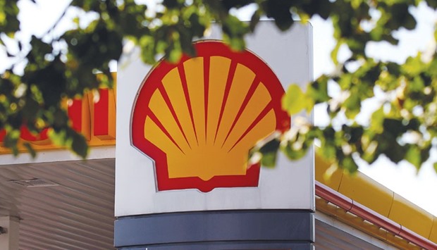 A logo is seen at a Royal Dutch Shell gas station in south London. More than 83% of Shell shareholders voted yesterday in favour of buying BG Group, the company said in a statement.