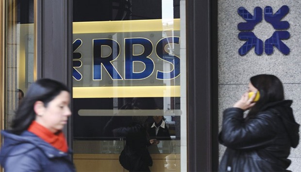 Pedestrians walk past an RBS branch in London. Chief executive Ross McEwan has been trying to clean up RBS so that the UK can shed the 73% stake it holds following the banku2019s u00a346bn rescue during the financial crisis.