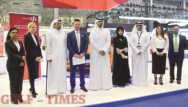 Commercialbank executive general manager (chief consumer & private banking) Dean Proctor and teammates announcing their banku2019s vehicle loan campaign at Qatar Motor Show yesterday. PICTURE: Noushad Thekkayil