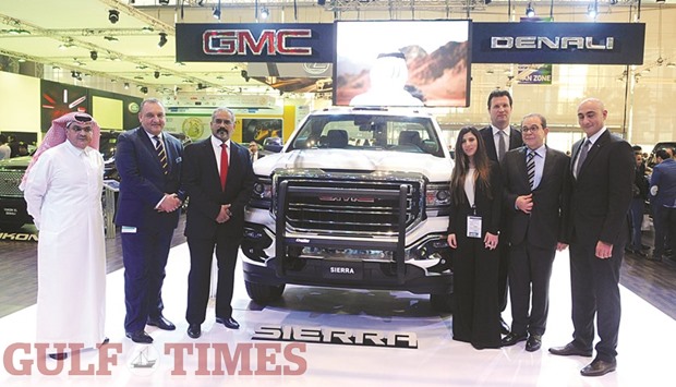 Mannai Auto Group and GMC officials present a GMC vehicle at Qatar Motor Show 2016 yesterday. PICTURE: Shemeer Rasheed