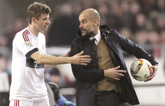 Manager Pep Guardiola (right), seen here with Thomas Muller, is losing the dressing room having announced last month that he will leave at the end of the season after three years in Munich.