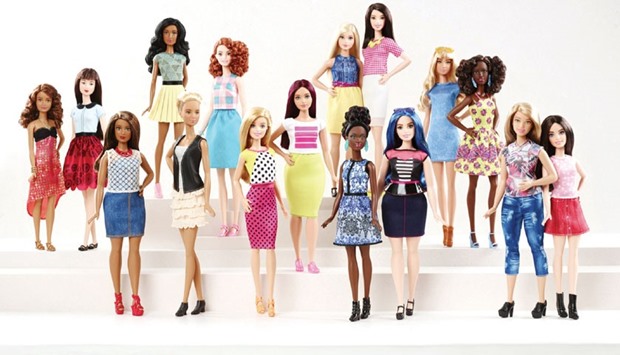 New Barbie doll body shapes of petite, tall and curvy are seen with the traditional Barbie in a photo released by Mattel yesterday.