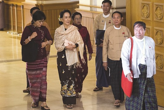 Chairperson of the National League for Democracy (NLD) Aung San Suu Kyi attends the last day of the Union parliament regular session in Naypyidaw yesterday.
