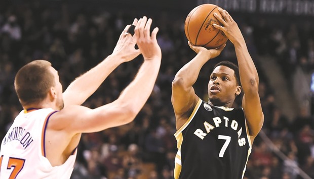 Toronto Raptors guard Kyle Lowry (No 7) shoots for a basket over New York Knicks forward Lou Amundson during the second half of the Raptors 103-93 win at Air Canada Centre. PICTURE: USA TODAY Sports