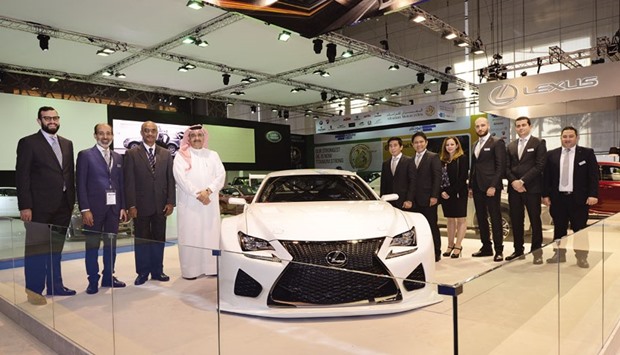AAB vice chairman Abdulrahman Abduljalil al-Abdulghani joins other officials during the launch of Lexus vehicles at the Qatar Motor Show.