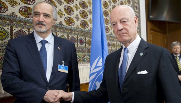 UN envoy Staffan de Mistura with Syria's Ambassador to the United Nations Bashar al Jaafari (L) duri
