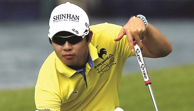 Song Young-Han of South Korea prepares to putt on the sixth hole during the third round of the weather-hit SMBC Singapore Open yesterday. (Reuters)