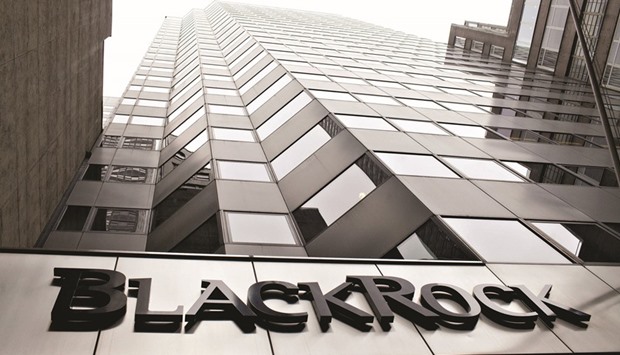 A BlackRock logo hangs above the entrance to its headquarters building in New York. BlackRock, Pacific Investment Management and Prudential Financial say debt from Europeu2019s peripheral nations are primed to excel once again as the European Central Bank extends its unprecedented bond buying.