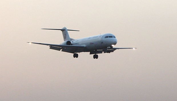 A photo made available on 23 January 2014 shows a plane of an Iranian airline approaching Mehr-Abad airport in Tehran. After the lifting of nuclear-related sanctions on January 16, Iranu2019s aviation industry is coming out of the shadows.