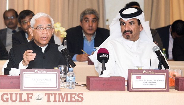 Indian ambassador Sanjiv Arora discusses the u201cMake in India Weeku201d while Qatar Chamber vice-chairman Mohamed bin Towar al-Kuwari looks on. PICTURE: Noushad Thekkayil