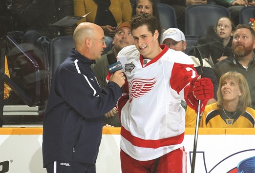 Dylan Larkin (right) of the Detroit Red Wings is interviewed after posting a record-breaking time of 13.172 seconds at the Bridgestone NHL Fastest Skater in Nashville, Tennessee, on Saturday. (AFP)