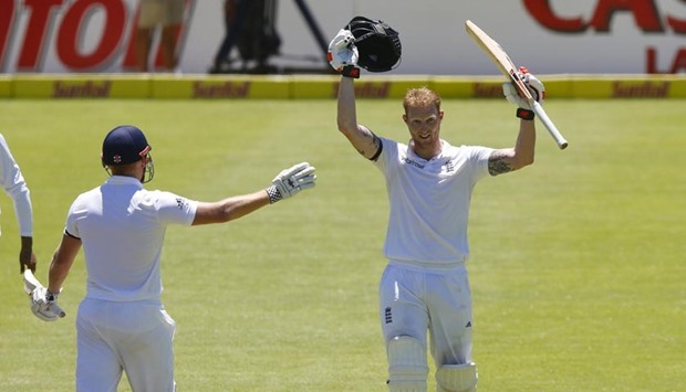 England's Ben Stokes celebrates scoring a double century with Jonny Bairstow during the second test against South Africa in Cape Town on Sunday.