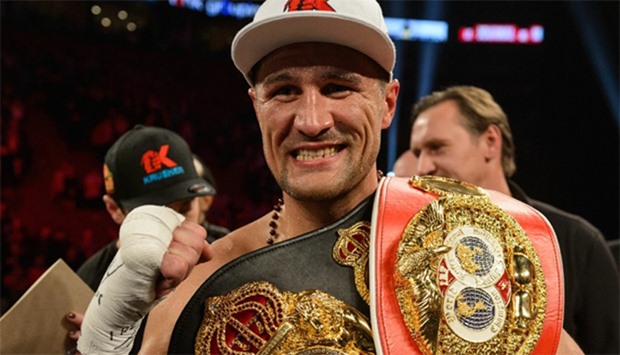 Sergey Kovalev of Russia posses with his belts after defeating Jean Pascal of Canada