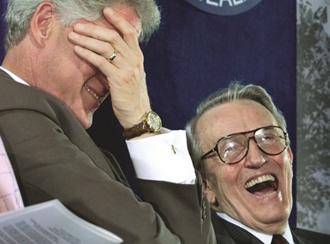 Then US president Bill Clinton u2018facepalmsu2019 during a ceremony to dedicate a vaccine research centre to former senator Dale Bumpers (right) and his wife, Betty, at the National Institute of Health in Bethesda, Maryland, in this file photo taken on June 9, 1999.