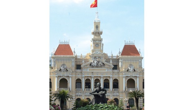 Ho Chi Minh City Hall in the French-built former Hotel de Ville de Saigon. Vietnam has gone a long way from its colonial past. The sitting statue in the front has been recently replaced with a standing and greeting Ho Chi Minh. PICTURE: Arno Maierbrugger