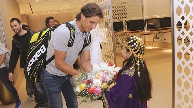Rafael Nadal of Spain is welcomed on his arrival in Doha for the 2016 Qatar ExxonMobil Open yesterday.