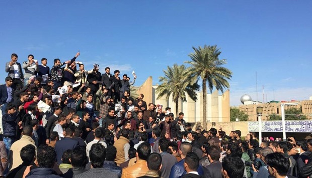 Iraqi students shout slogans during a protest held on the Baghdad campus of Al-Mustansiriya University against the execution of a Shia cleric.