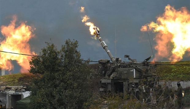 An Israeli artillery gun fires a shell into Lebanon, after a roadside bomb exploded next to an Israeli military border patrol near the Shebaa Farms area, near Kiryat Shmona, Israel.