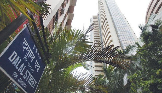 The Bombay Stock Exchange (right) is seen on the Dalal Street in Mumbai. The S&P BSE Sensex of the nationu2019s biggest companies fell 5% in 2015, compared with gains of at least 6% for gauges of mid and small-cap shares.