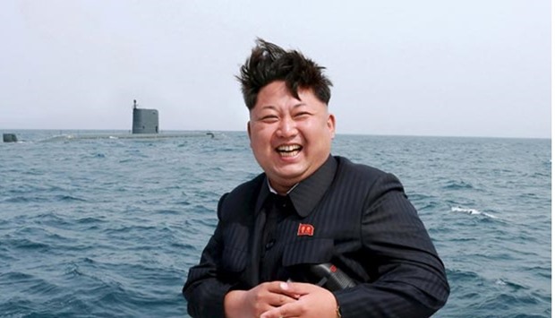 North Korean leader Kim Jong Un watches the test-fire of a strategic submarine underwater ballistic missile in this undated file photo. North Korea said it had successfully conducted a test of a miniaturised hydrogen nuclear device on Wednesday.