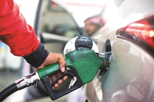 A Saudi employee fills his car at a petrol station in Jeddah. The total cost of energy subsidies in the worldu2019s top oil exporter was estimated at $61bn last year.