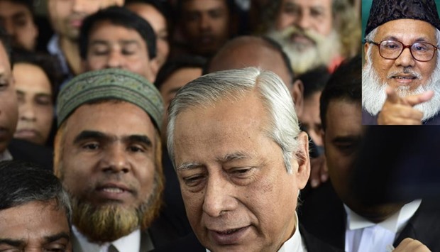 Bangladeshi Attorney General Mahbubey Alam (centre) walks through the Supreme Court during a review of a petition relating to the appeal of Jamaat-e-Islami leader Motiur Rahman Nizami (inset) against his sentence, which was dismissed by the Supreme Court in Dhaka on Wednesday.