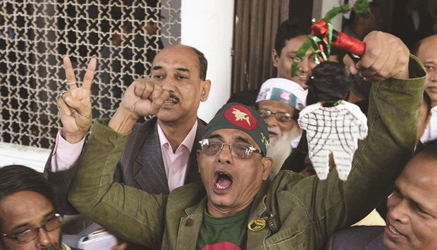 Activists who fought in the 1971 war celebrate after a review petition relating to Jamaat-e-Islami leader Motiur Rahman Nizamiu2019s appeal against his death sentence, was dismissed by the Supreme Court in Dhaka yesterday.