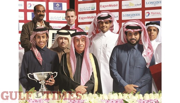 Qatar Racing and Equestrian Club general manager Nasser Sherida al-Kaabi with the winners of Al Mafiar Cup at the QREC yesterday.