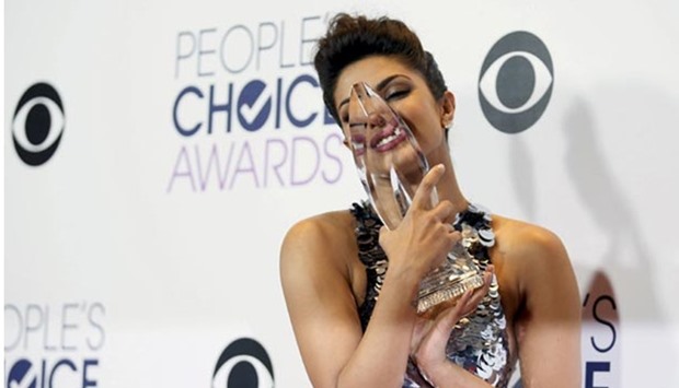 Priyanka Chopra of Quantico poses backstage with her award for Favorite Actress in a New TV Series during the People's Choice Awards 2016 in Los Angeles on Wednesday.