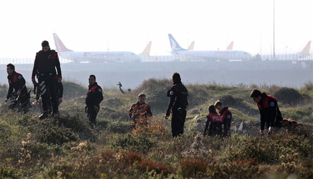 Turkish police search the area around Sabiha Gokcen international airport in Istanbul on 23 December after an explosion left one dead.