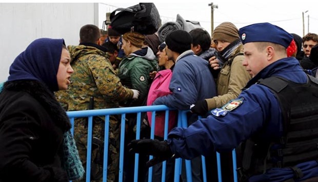 Hungarian border police arrive at a transit camp on the Macedonia-Greece border near Gevgelija this week to help Macedonian authorities manage the flow of migrants.