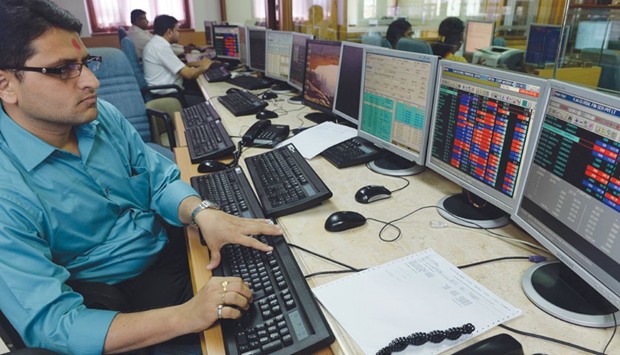 A trader monitors share prices on his terminal at a brokerage house in Mumbai. The Sensex gained 0.3% at the close yesterday, narrowing its first weekly loss in four weeks to 4.7%, still the steepest since November 2011.