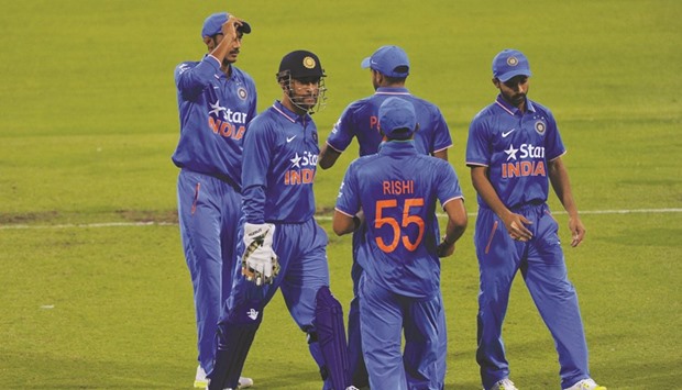 India captain MS Dhoni with his teammates during the T20 match against a Western Australian XI in Perth yesterday. India won by 74 runs. (AFP)