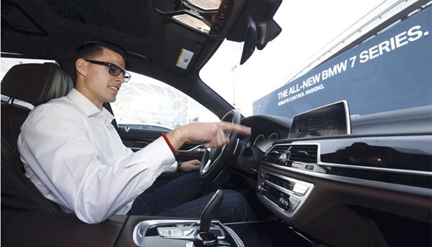 A BMW official demonstrates a gesture-control feature in a BMW 750i sedan during the 2016 CES trade show in Las Vegas yesterday. Given that drivers have enough to do keeping their hands on the wheel and eyes on the road, touch-free controls for some non-essential functions makes sense. But it is not clear all drivers want gesture, eye-tracking or even lip-reading technology.