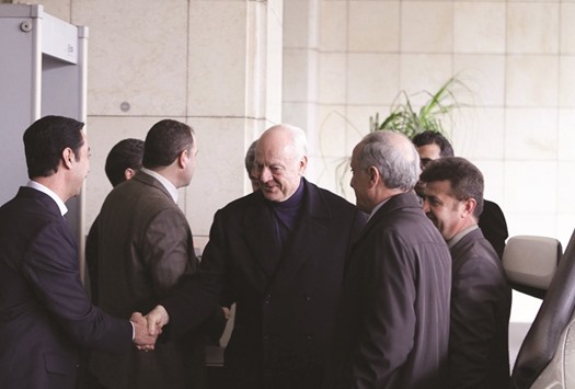 UN envoy for Syria, Staffan de Mistura (centre), arrives at his hotel with Syrian assistant foreign minister, Ayman Sosan (second from right) in Damascus yesterday.
